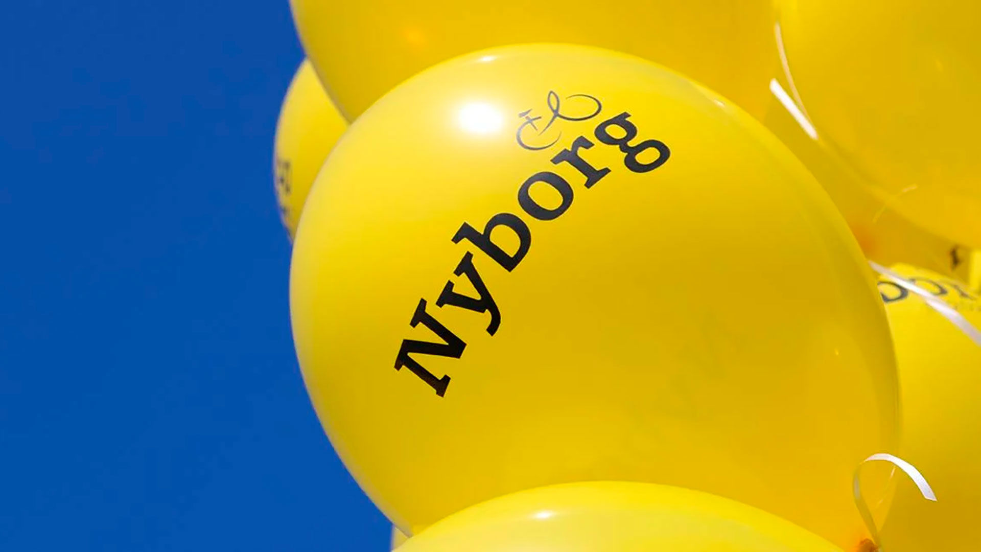 Gule 'Vi mødes om touren' balloner