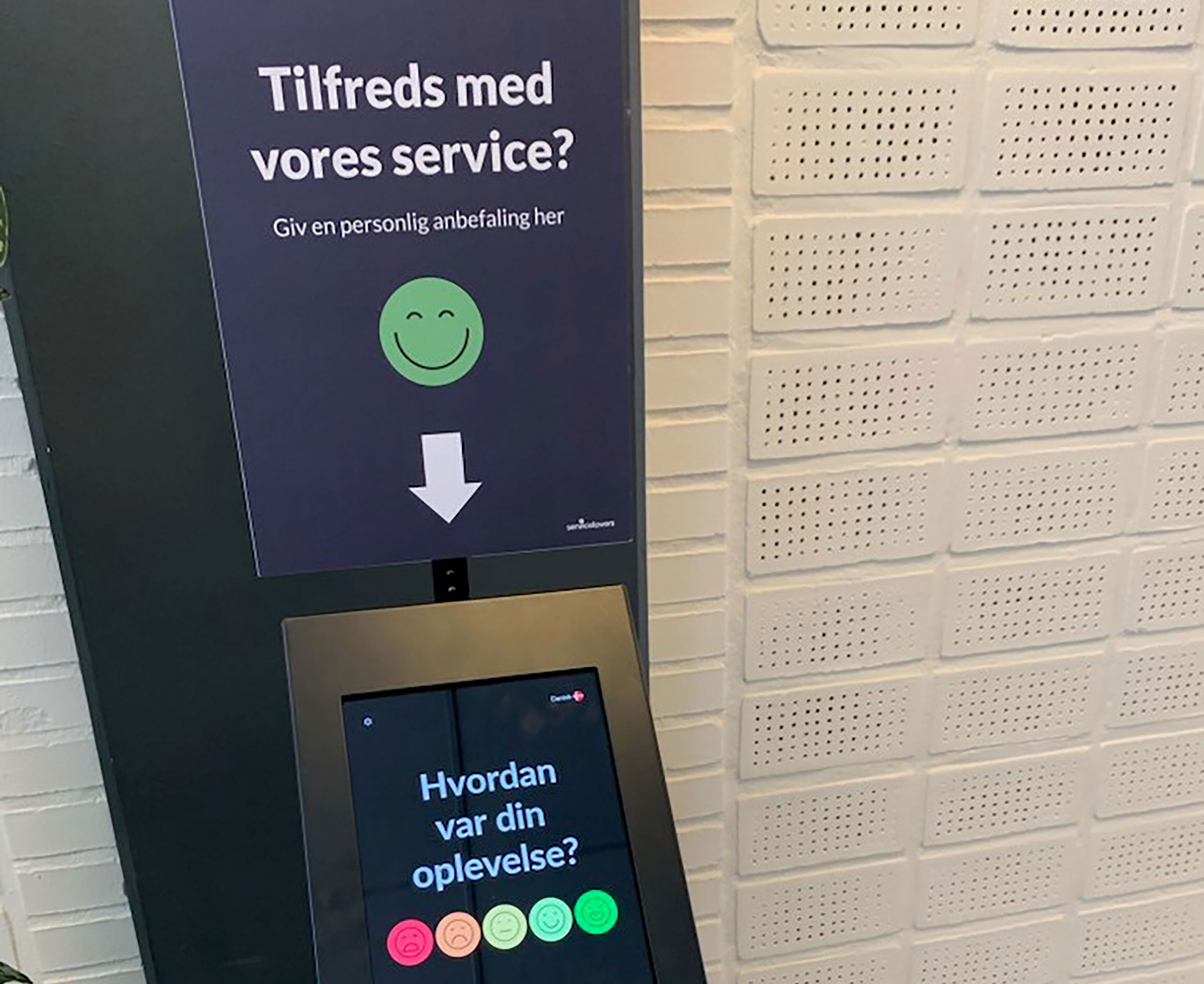 Stander med ordlyden ' Hvor tilfreds er du med vores service?"