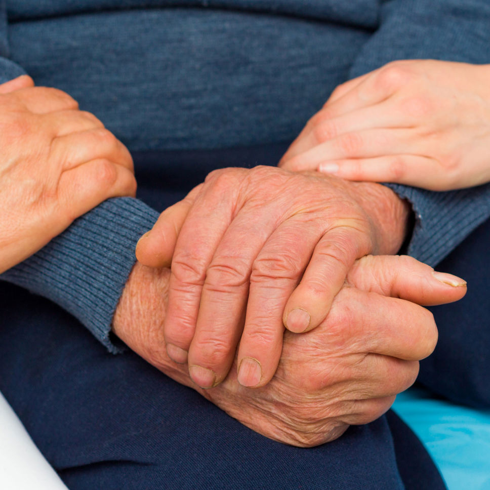 Hænder der yder omsorg