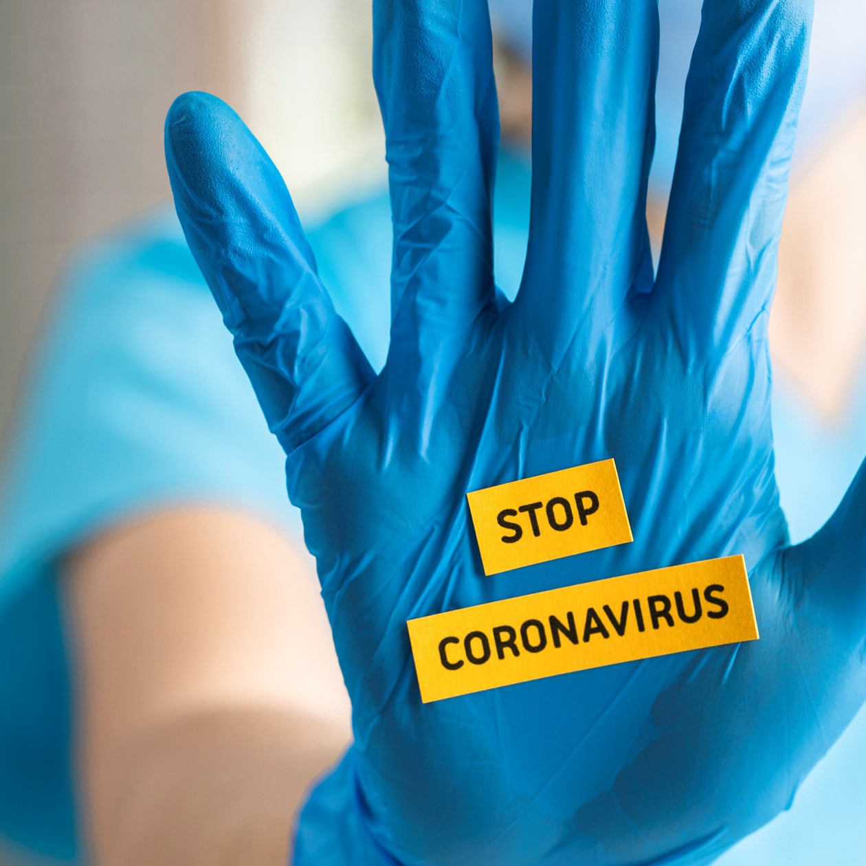 Engangshandske med teksten 'Stop coronavirus'