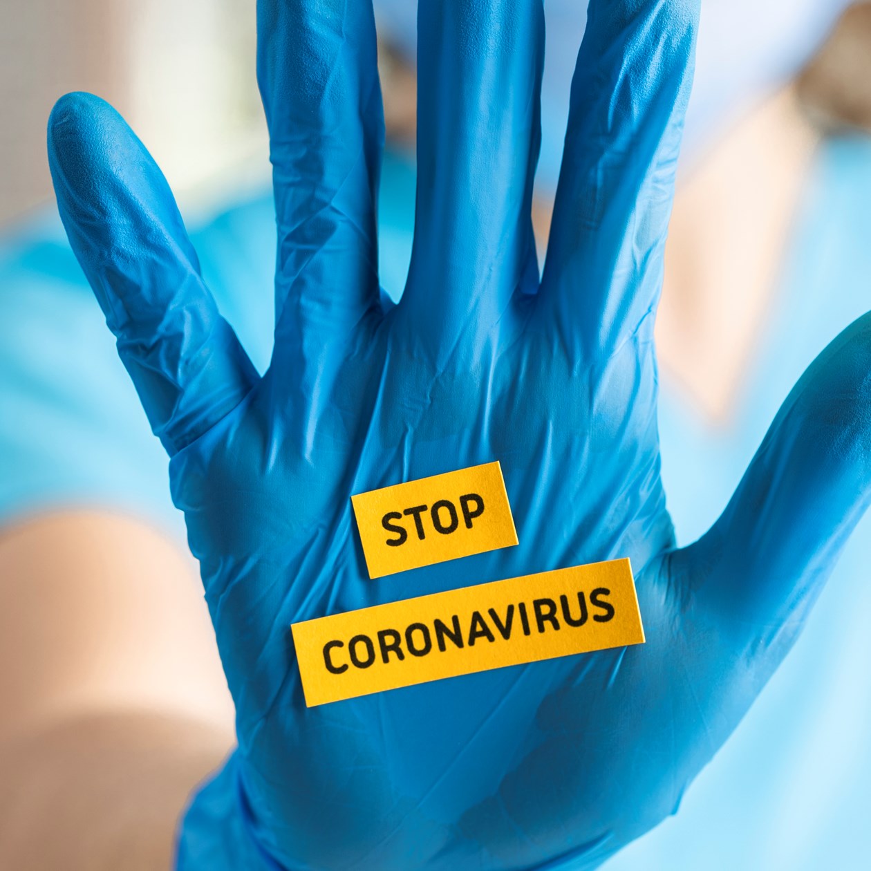Engangshandske med teksten 'Stop coronavirus'